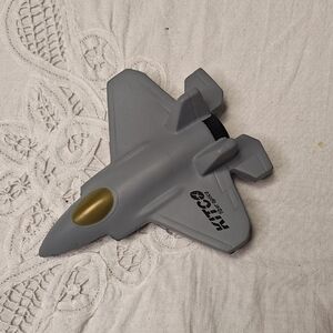 Gray and Gold Toy Jet